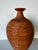 A beautifully handcrafted studio pottery bud vase featuring an organic, sculptural silhouette and richly textured surface....