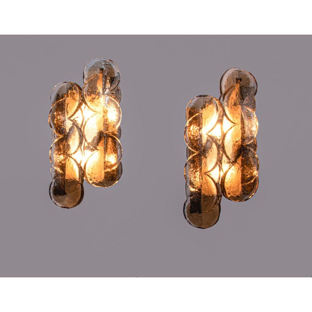 Elegant set of two amber-colored 'citrus' wall lights with two swirled glasses per light on a metal frame with brass and...