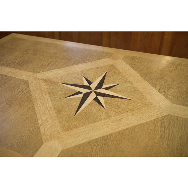 Large sculptural oak table, 1950s An imposing oak table with a rectangular top featuring geometric marquetry and a central...