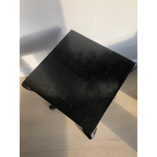 Tessellated black marble stone pedestal or accent side table with 14" x 14" square top surface, gracefully curved sabre...