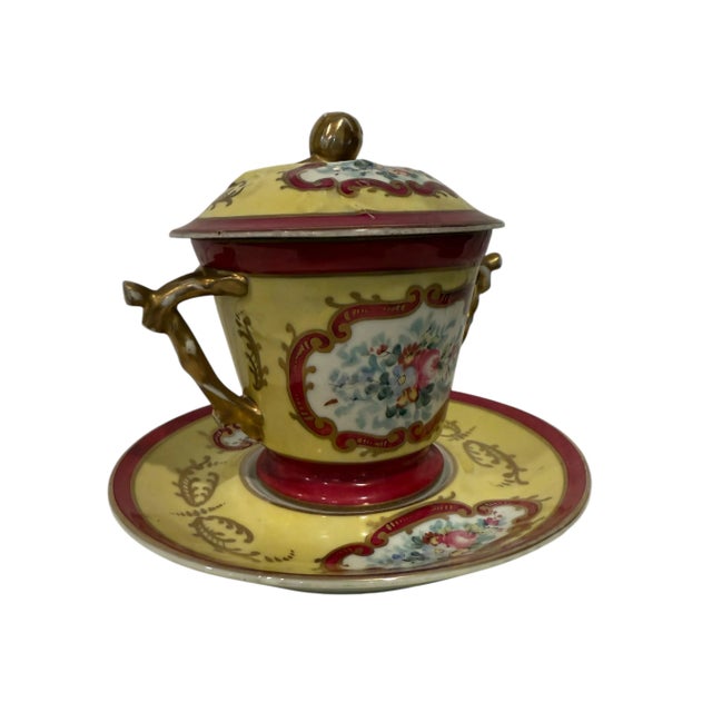 A charming candy bowl set, complete with a matching lid, bowl, and plate. The set is decorated with ornate patterning on...