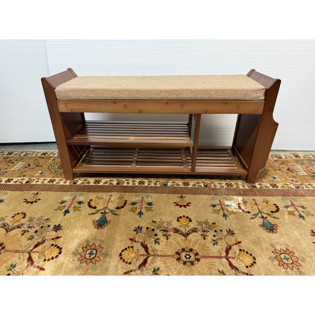 Design Plus Gallery presents a Padded Seat Bench for Shoe Organization. The bench has a loose seat that is padded to rest...