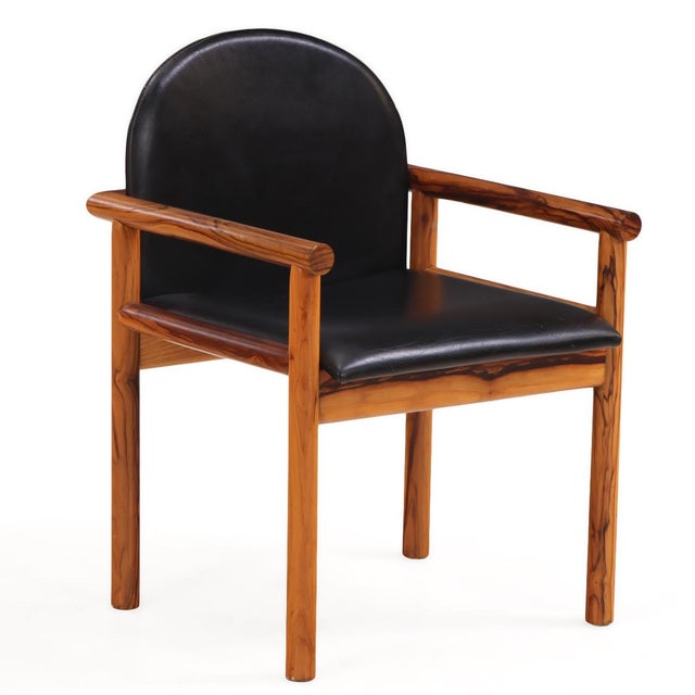 A striking set of six Italian armchairs, C. 1965, crafted in richly figured olive wood. Each chair features a gracefully...