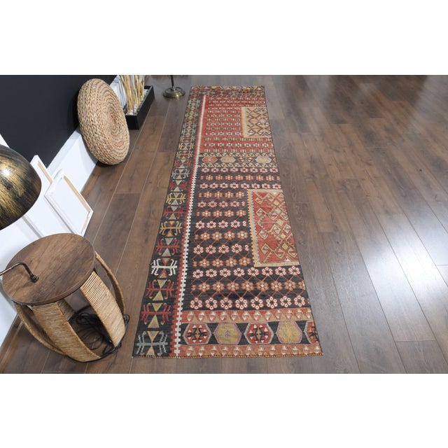 Vintage Hand-Knotted runner rug is a semi-antique vintage area rug. The '70s Eastern region of Anatolia's unique rug is...