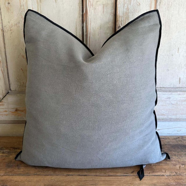 Custom linen blend accent pillow. Color: elephant / a moody med. grey colored nubby textured style pillow with a stitched...