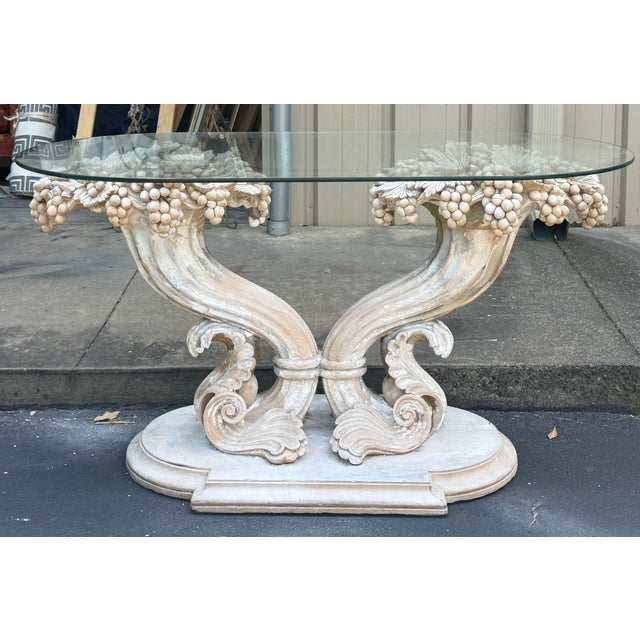 This is a neo-classical style carved wood cornucopia form console table. The finish is intentionally stripped and cerused...