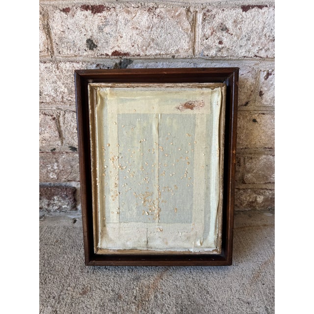 Vintage abstract artwork in its original frame. This highly textured piece features a light colored linen fabric that...