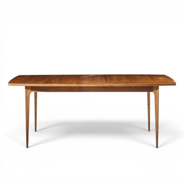 Broyhill Brasilia Mid Century Walnut Expanding Dining Table with 1 Leaf This table measures: 66 wide x 40 deep x 29.75...