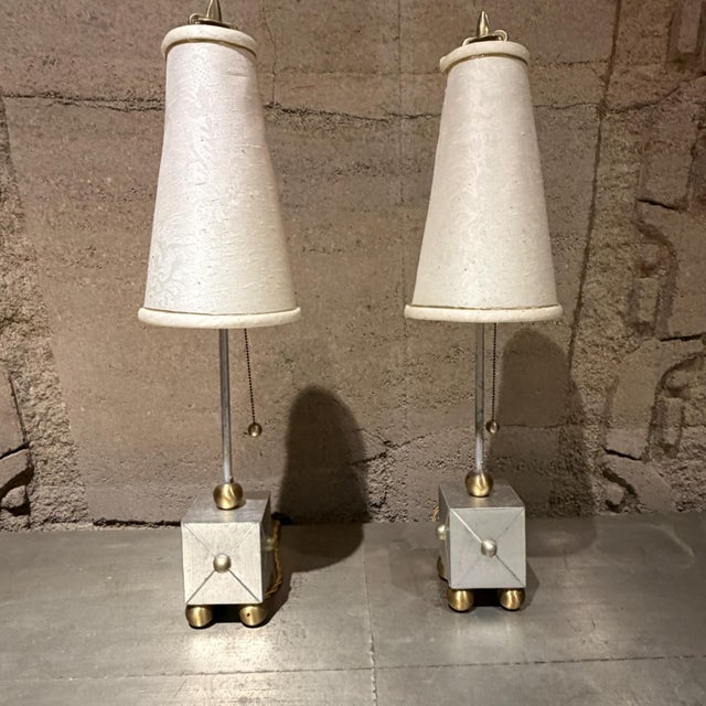 For your consideration, a pair of 1970s French Fleur-de-Lis table lamps. These unique lamps are crafted in the distinct...
