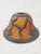 This vintage Meyda amber-color bent glass lampshade features an art deco style design with bows and ribbon accents....