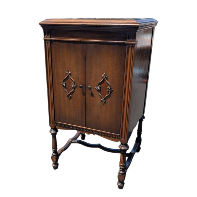 An original early-20th-century Horner-Kelly for Brunswick crank phonograph cabinet, thoughtfully repurposed as a handsome...