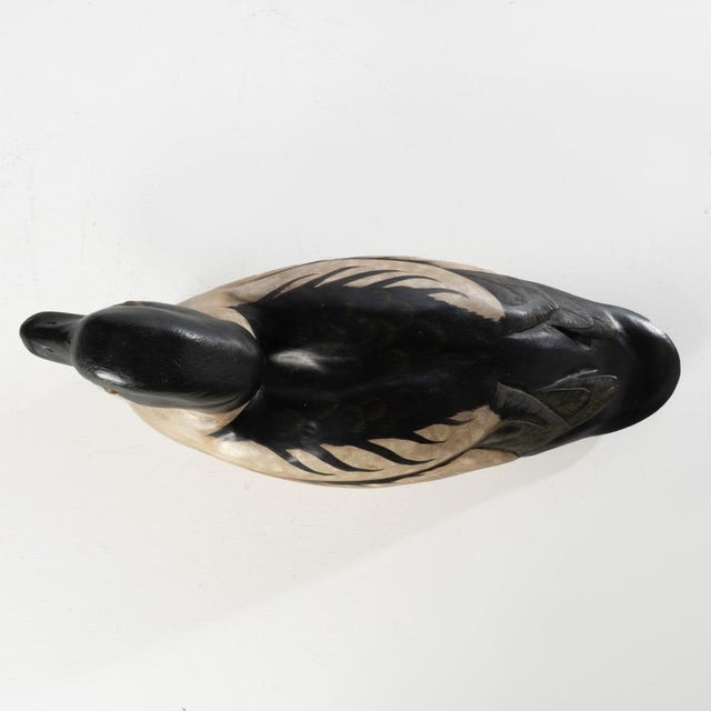 Beautifully made duck decoy. Cannot confirm if the signature on the bottom is from the maker or the original person who...
