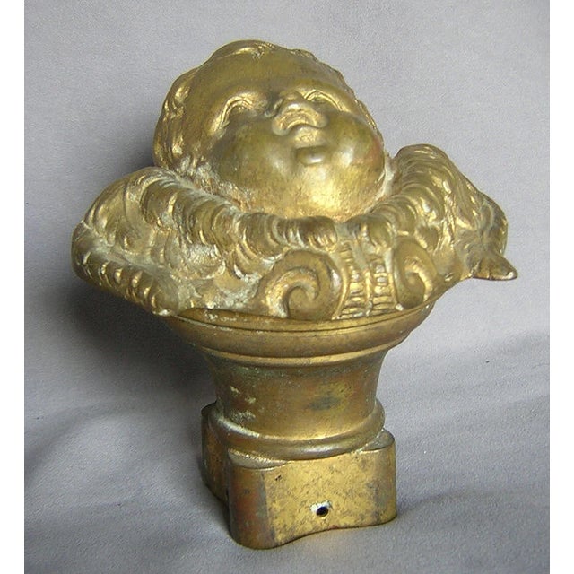 An Antique Victorian Architectural Newel Post Finial. The finial is in the figural form of a Cherub Angel or Putto. It is...