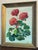 A vibrant vintage framed painting of a geranium plant with green leaves and red flowers. Framed in gold toned wood and...