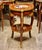 Elevate your interior with this elegant French Louis XV-style side table, crafted from richly finished wood and adorned...