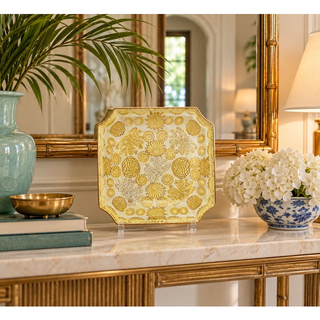 Elegant octagonal porcelain tray featuring a soft pale yellow ground with intricate gilt decoration throughout. The design...
