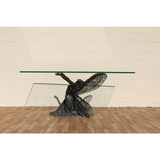 A truly captivating vintage dining table featuring a sculptural bronze fairy maiden base, beautifully paired with a large...