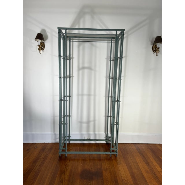 Fabulous Iron and Glass Etagere in the style of Walter Lamb. Aged patina finish with glass shelving. Striking angles with...
