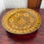 Large round hand painted shallow ceramic bowl from Morocco. The saffron yellow and orange ground is outlined and dotted in...