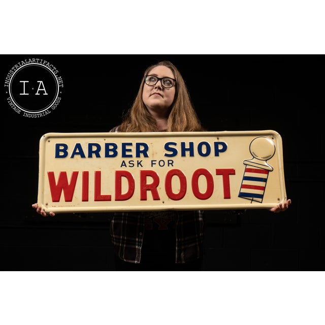c. 1955; A-M Sign Co. - Lynchburg, VA Embossed tin advertising sign for Wildroot hair products, featuring bold red and...