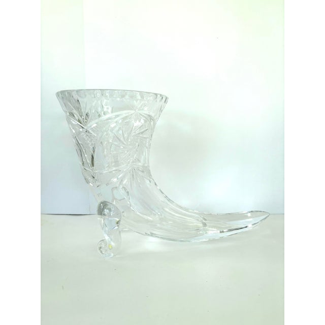 Celebrate vintage European craftsmanship with this West Germany cut crystal cornucopia vase, produced circa 1960s–1980s....