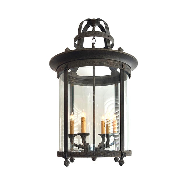 a good reproduction of neoclassical style featuring an iron and bronze frame adorned with egg and leaf moldings and berry...