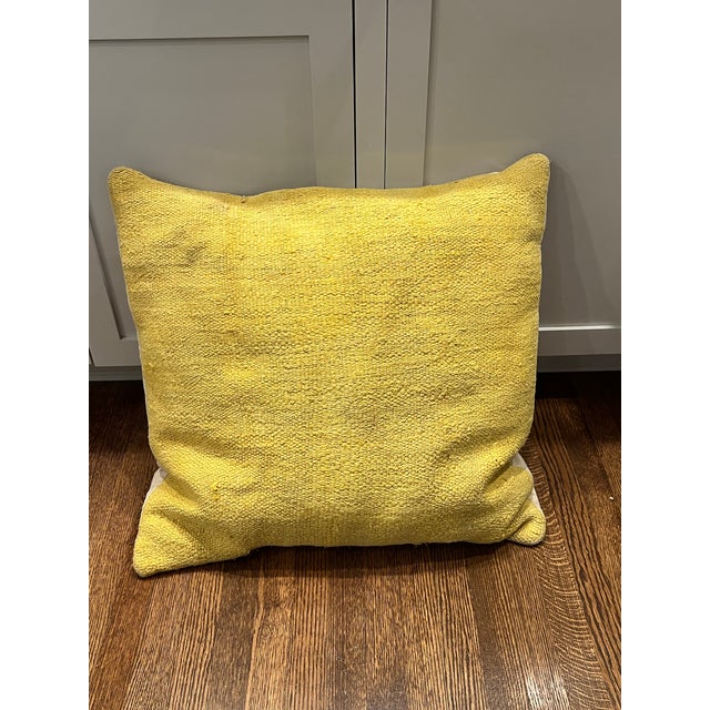 Creamy sail cloth fabric on back, envelope insert, down pillow insert. Has cool textured textile on front in canary yellow