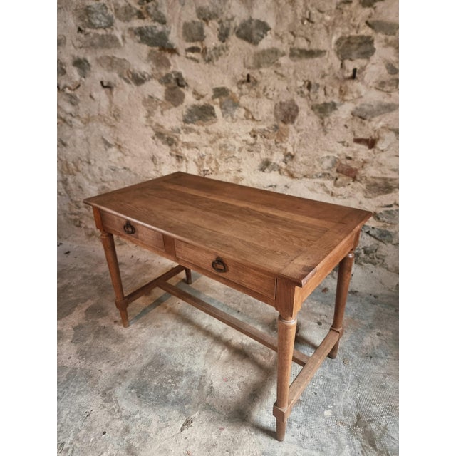 Antique French table in solid oak, dating from the 1930s. The piece features a warm oak tone with a naturally developed...