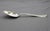 Late 19th century "Cupid" pattern sterling silver serving spoon, American. 1878 patent design of Morgan Morgans, Jr., and...