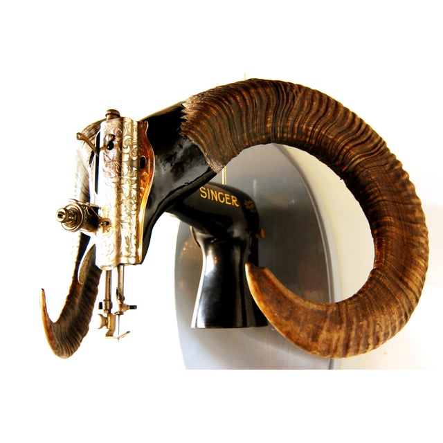Also called Rudolph the Judge. Sewing machine taxidermy. A futuristic objet d'art for the wall. Real Ram's horns. This...