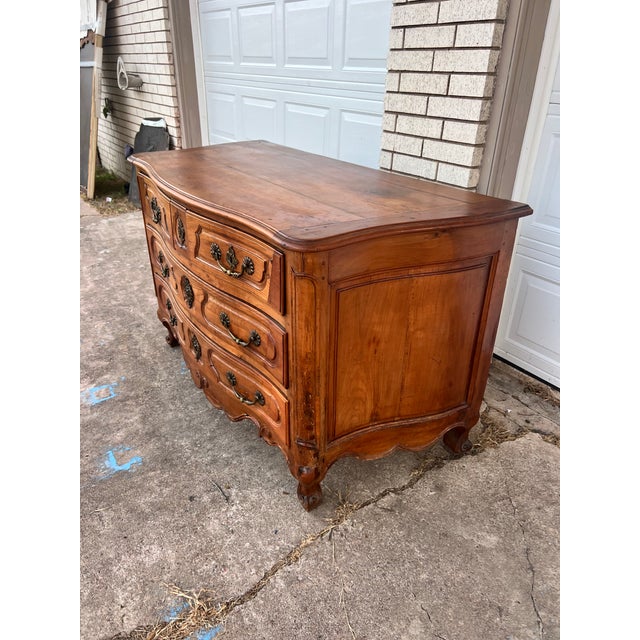 An elegant 18th-century Louis XV château period commode, crafted in solid walnut with a beautiful warm natural patina...