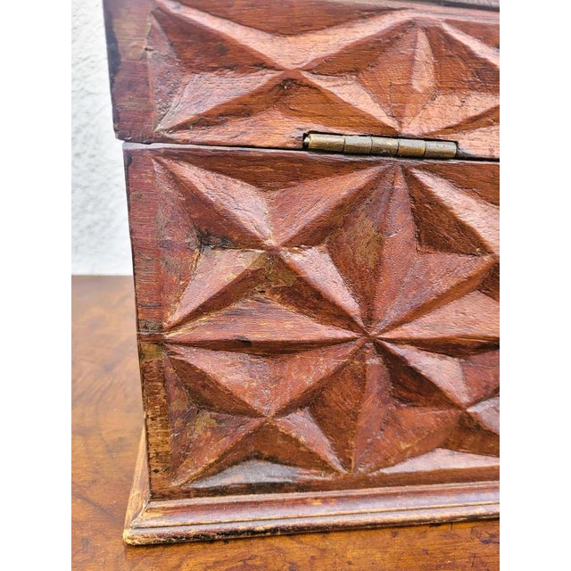 Beautiful wooden chest carved with a geometric motif, with interior compartments and iron handles. Missing the lock, some...