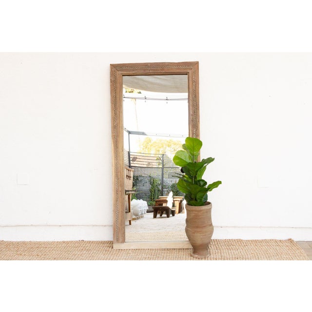 Originally a 19th-century doorway in an Indo-French Haveli, this exquisite antique mirror is a rare architectural...