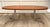 Here is a wonderful Mid-Century Modern oval coffee table, dating to the 1960s. The elongated oval top features warm wood...