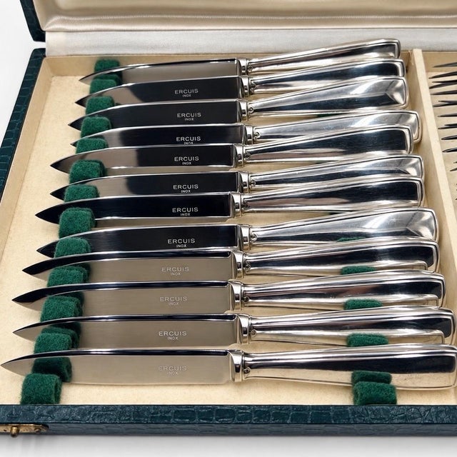 This superb Ercuis stainless steel and silver-plated dessert flatware set exemplifies the elegance of 20th-century French...
