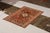 Hand-knotted in wool originating from Turkey circa 1910-1920, this antique rug connotes a transitional Kirsehir rug...