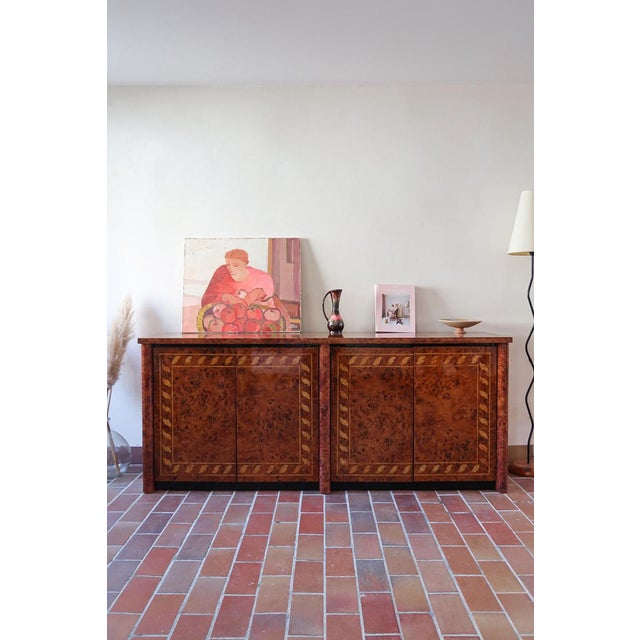 A high-gloss burl elm sideboard of unusually fine quality, Italian, 1970s. The veneer has the swirling, restless grain...