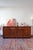 A high-gloss burl elm sideboard of unusually fine quality, Italian, 1970s. The veneer has the swirling, restless grain...