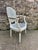 Louis XVI style medallion armchair, seat and back in white and blue caning, fabric-covered armrests with studs. Some signs...