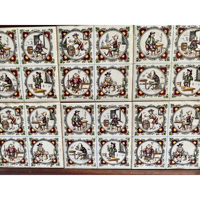 One of a kind tray, the tiles depict a Dutch man doing various things.