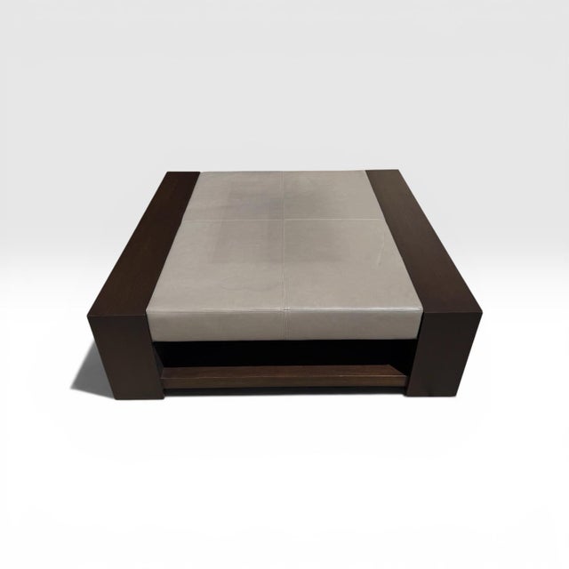 Bahia Coffee Table by iconic designer Holly Hunt. Grey leather upholstered top with elegant minimal stitching surrounded...