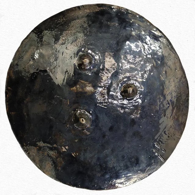 Angelo Rinaldi, ''Galaxy'' ceramic sculpture, with geometric elements in relief, black enamel iridescent h. cm. 6x53,5,...