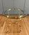 Vintage French style solid brass end table with a glass top in the style of LaBarge circa 1970s. It features octagonal...