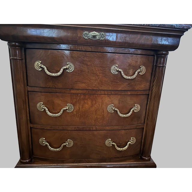 Owned by one family, a bedside chest in the neoclassical style by Henredon, of Morganton, North Carolina, USA. Burl elm...