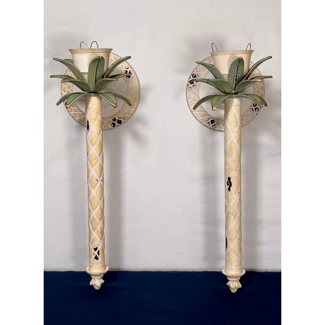 Pair of mid-century Italian Hollywood Regency wall candle sconces, bringing an immediate touch of Palm Beach elegance to...