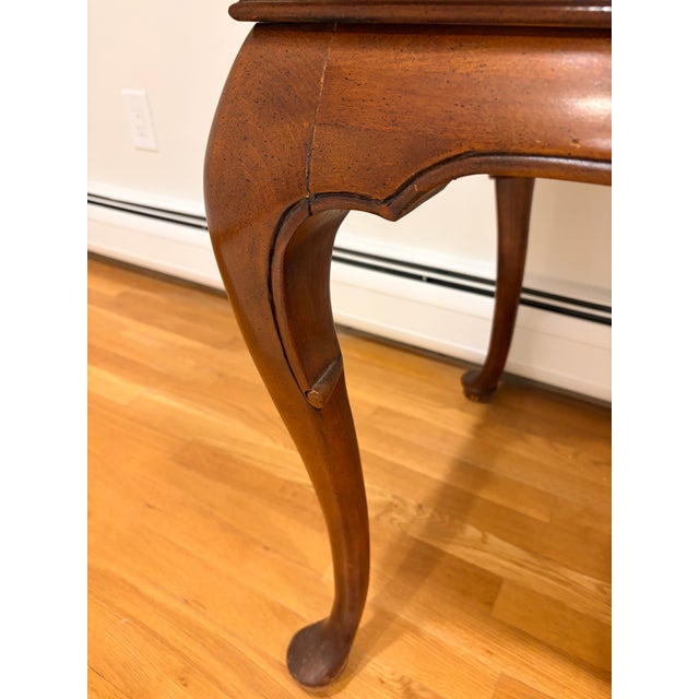 Burl veneer doors with a bookmatched mirrored grain and a banded border with fine inlay lines Cabinet is on a regal Queen...