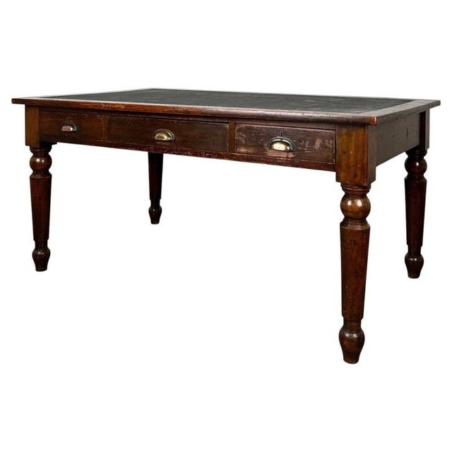 A fine antique English writing table by the celebrated cabinetmakers Holland & Sons, beautifully crafted from mahogany and...