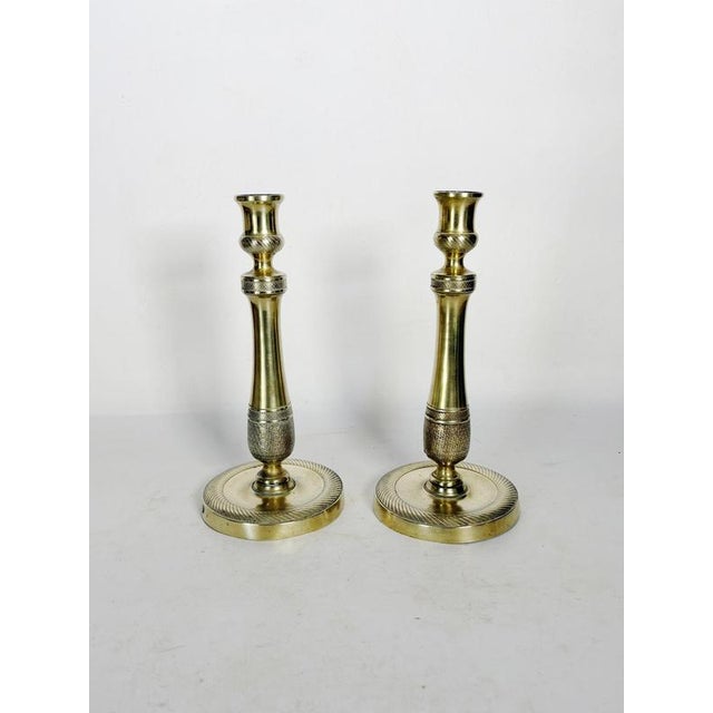 Pair of brass candlesticks, France, 19th century, elegant and finely crafted, illustrating the decorative expertise of the...