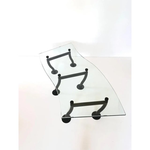 Postmodern design coffee table, 1980s 1.8 centimetre thick glass top with an impressive design. The asymmetrical black...