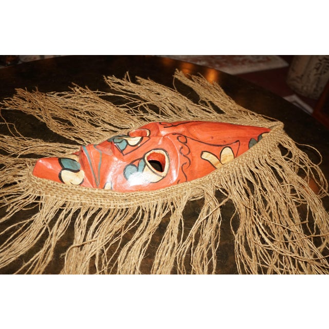 Tribal Hand-Painted Tribal-Style Wooden Mask With Natural Fiber Fringe – 18” For Sale - Image 3 of 4